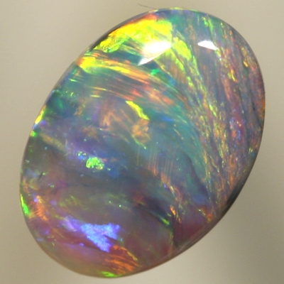SOLID CRYSTAL OPAL Green and orange fire moves from side to side